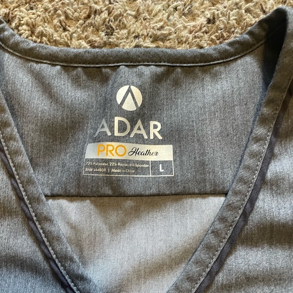 Scrub tops, like new. Sizes on pics, $20 each or all 3 for $50. - Picture 4 of 4